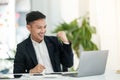 Young asian handsome man very happy and excited doing winner gesture with arms raised, smiling and screaming for success Royalty Free Stock Photo