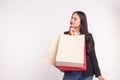 Young asian happy woman with shopping bags on white background with copy space Royalty Free Stock Photo