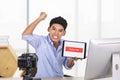 Young Asian influencer holding a table with subscribe sign