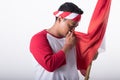 Young asian kissing red and white flag of indonesia