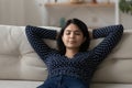 Young asian lady having rest on couch at day time Royalty Free Stock Photo