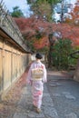 Young Asian Lady in Kimono walking in an empty Street in Higahiyama District, Gion, Kyoto, Japan Royalty Free Stock Photo