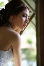 Young Asian lady in white bride dress