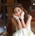 Young Asian lady in white bride dress