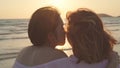 Young Asian lesbian couple kissing near beach. Beautiful women lgbt couple happy relax enjoy love and romantic moment when sunset Royalty Free Stock Photo