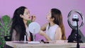 Young asian makeup artist woman live streaming how to make up with pretty woman