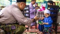 Young Asian Malay kids getting a envelope of money or Duit Raya during the Hari Raya Aidilfitri celebration