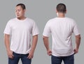 Young Asian male in blank black t-shirt, front and back view, isolated over gray background. Design men shirt mock up template or