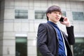 Young Asian male business executive using smart phone