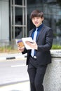 Young Asian male business executive using tablet PC Royalty Free Stock Photo