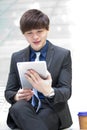 Young Asian male business executive using tablet PC Royalty Free Stock Photo