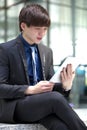 Young Asian male business executive using tablet PC Royalty Free Stock Photo