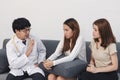 Young Asian male doctor consulting patient in hospital office. Health care and medical concept. Royalty Free Stock Photo