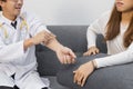 Young Asian male doctor consulting patient in hospital office. Health care and medical concept Royalty Free Stock Photo