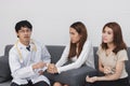 Young Asian male doctor consulting patient in hospital office. Health care and medical concept Royalty Free Stock Photo