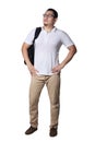 Young Asian male student wearing glasses looking up and thinking while holding backpack. Full body portrait Royalty Free Stock Photo