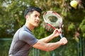 Young asian male tennis player Royalty Free Stock Photo