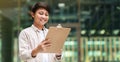 Young asian man assistant manager holding clipboard Royalty Free Stock Photo