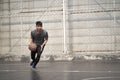 Young asian man basketball player attempting a dunk outdoors Royalty Free Stock Photo