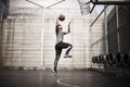 Young asian man basketball player attempting a dunk outdoors Royalty Free Stock Photo