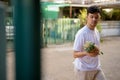 Young Asian man bringing pineapple at home Royalty Free Stock Photo