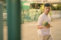 Young Asian man bringing pineapple at home Royalty Free Stock Photo