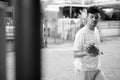 Young Asian man bringing pineapple at home Royalty Free Stock Photo