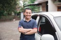 Standing in front of car. male taxi driver Royalty Free Stock Photo