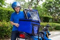 Young Asian man with delivery box.