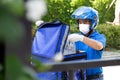 Young Asian man with delivery box.