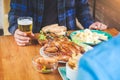 Young asian man drinking beer and clink glasses happy while enjoying home party Royalty Free Stock Photo