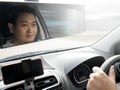 Young Asian Man Driving a Car Royalty Free Stock Photo