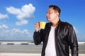 Young Asian Man Enjoy a Cup of Coffee Royalty Free Stock Photo