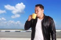 Young Asian Man Enjoy a Cup of Coffee Royalty Free Stock Photo