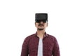 Young asian man experiencing virtual reality through a VR headset Royalty Free Stock Photo