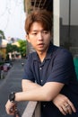 Young Asian man hair style men in navy blue shirt casual portrait. Royalty Free Stock Photo