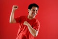 Young asian man happy and excited expressing winning gesture. Successful and celebrating Royalty Free Stock Photo