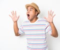 Young Asian man with hat feels shock and surprise with overly face expression. Royalty Free Stock Photo