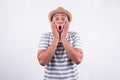 Young Asian man with hat feels shock and surprise with overly face expression. Royalty Free Stock Photo