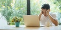 Young Asian man having stressful time working on laptop. Royalty Free Stock Photo