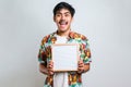 Young asian man holding blank letterboard pointing with finger to the camera and to you Royalty Free Stock Photo