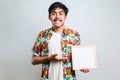 Young asian man holding blank letterboard pointing with finger to the camera and to you Royalty Free Stock Photo