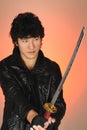 Young asian man holding sword Royalty Free Stock Photo