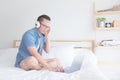 man listening music from smart phone via headphones Royalty Free Stock Photo