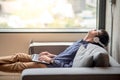 Young asian man listening to music from laptop computer Royalty Free Stock Photo