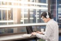 Young Asian man listening to music while working Royalty Free Stock Photo