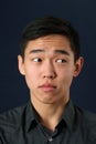 Young Asian man looking sideways Royalty Free Stock Photo