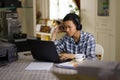 Serious teenage asian boy study at home Royalty Free Stock Photo