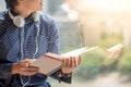 Young Asian man reading book in library Royalty Free Stock Photo