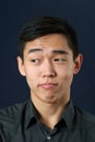 Young Asian man rising eyebrows Royalty Free Stock Photo